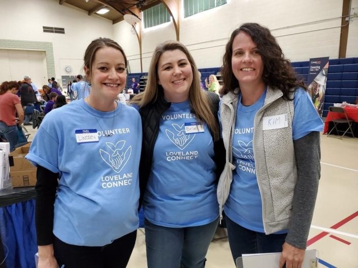 Volunteering for Loveland Connect 3 Female Volunteers for Loveland Connect Inside A School Gym