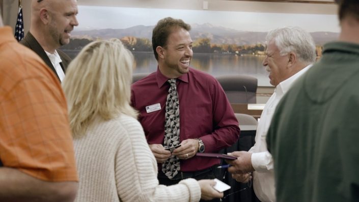 Paul with people at Town Hall Presentation Town Hall meeting