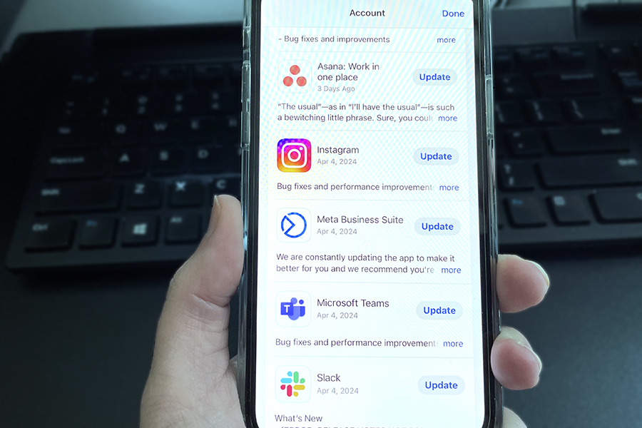 Photo of phone with several apps that need to be updated