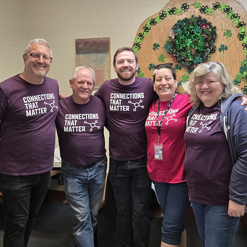 Photograph of 5 Pulse employees volunteering at Loveland's Community Kitchen