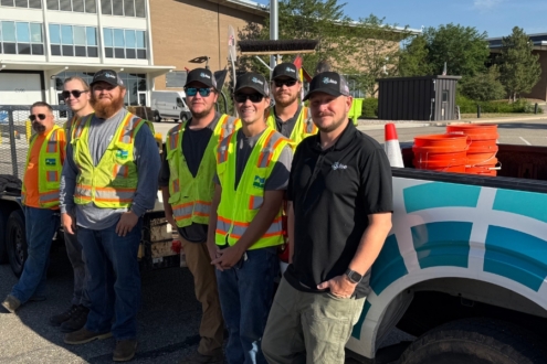 A Team of Pulse installers standing next to a Pulse truck