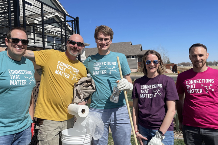 Photograph of several Pulse employees at a volunteer clean-up event