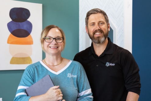 Two Pulse customer service employees posed